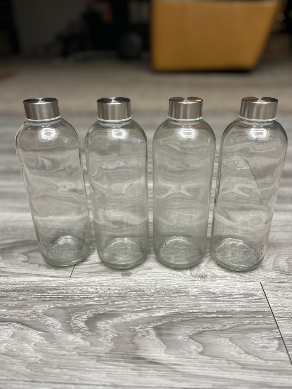Set of 4 Clear Glass Water Bottles with Stainless Sealing Caps